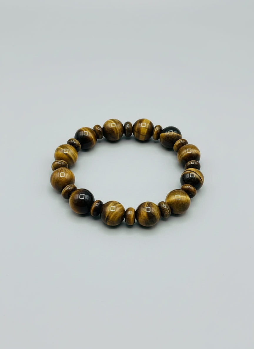 Beaded bracelet with tiger eye and rondelle bead stones on a wooden surfaces 