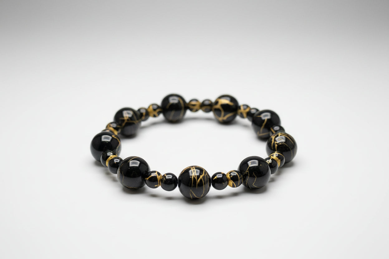 12mm_and_6mm_Black Golden Wire Agate Beads
on a laptop keyboard