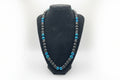Black stand with blue & matte beads trim on a white background