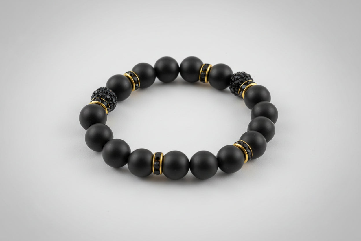 Black beaded bracelet on a wooden surface