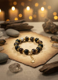 Black  Onyx bracelet with gold spacer and chain link charm