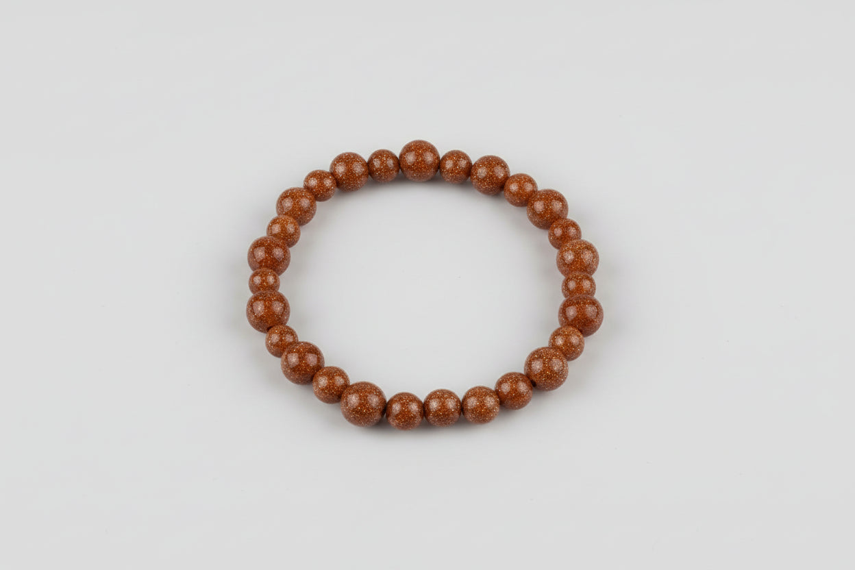 Brown beaded bracelet on a wooden surface