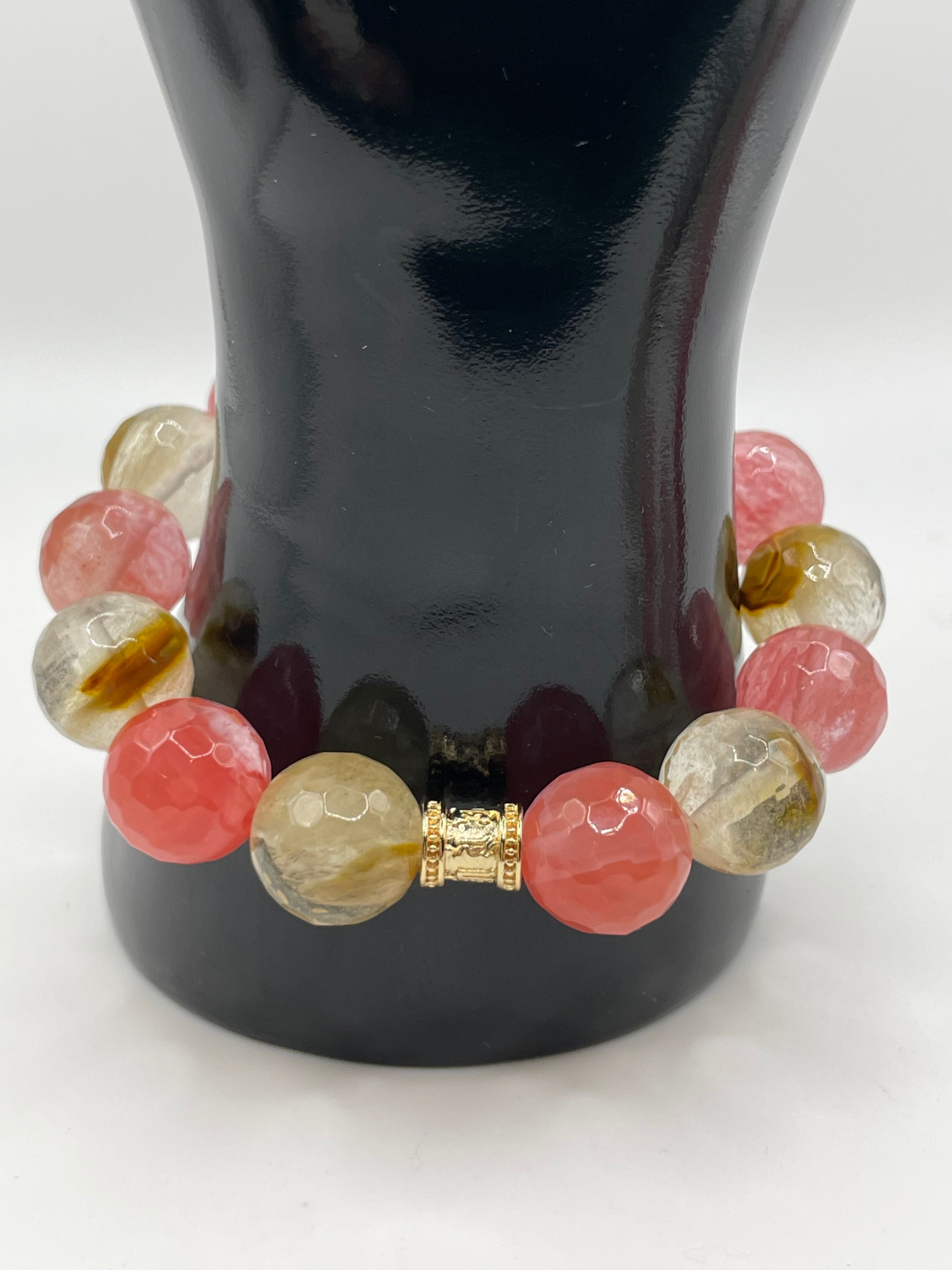 Multicolored beaded bracelet on a reflective surface