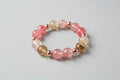 Multicolored beaded bracelet on a wooden surface