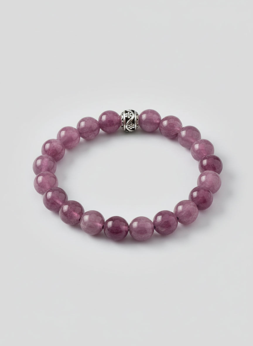 Purple beaded bracelet on a wooden surface