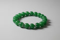 Green beaded bracelet on a wooden surface