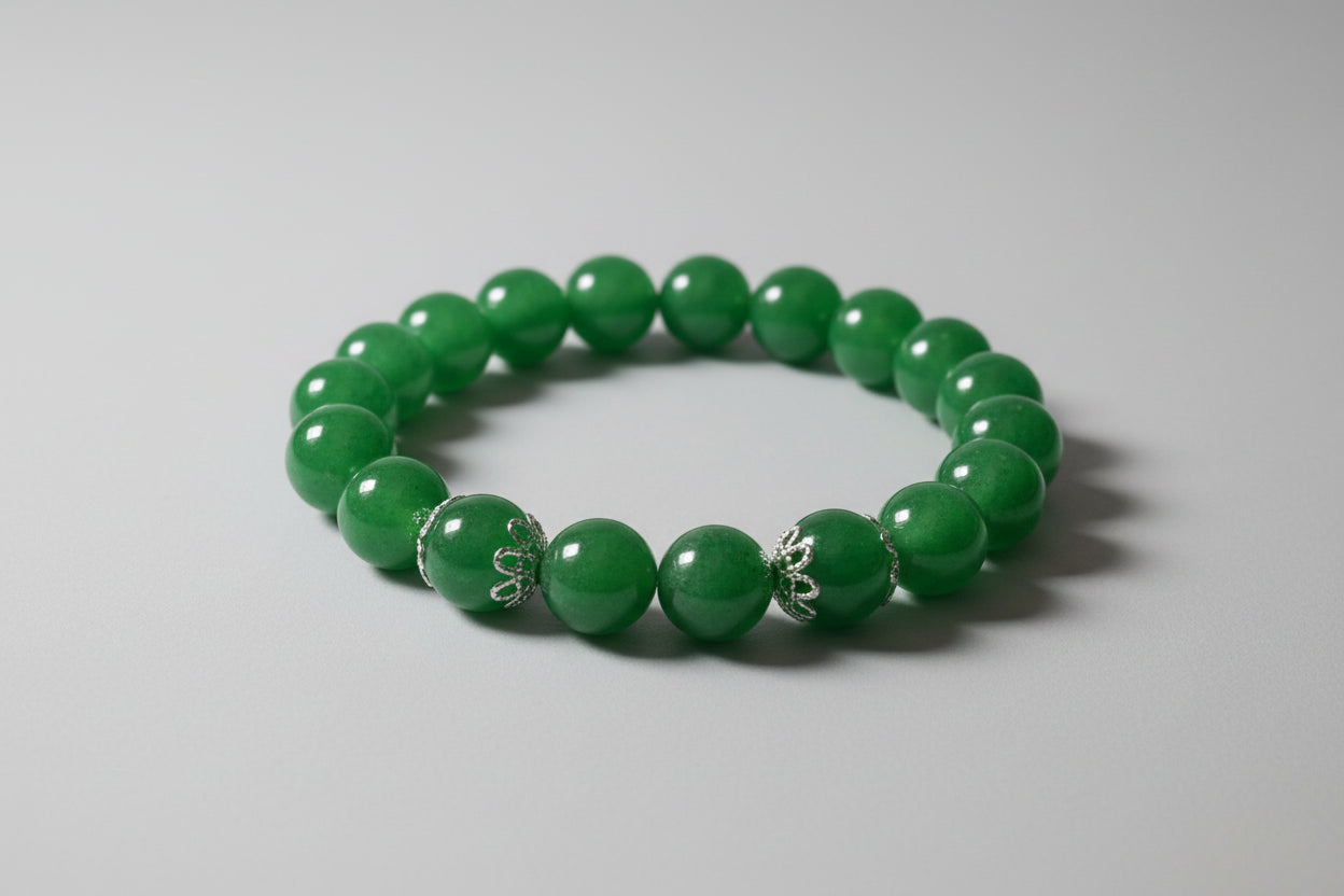 Green beaded bracelet on a wooden surface