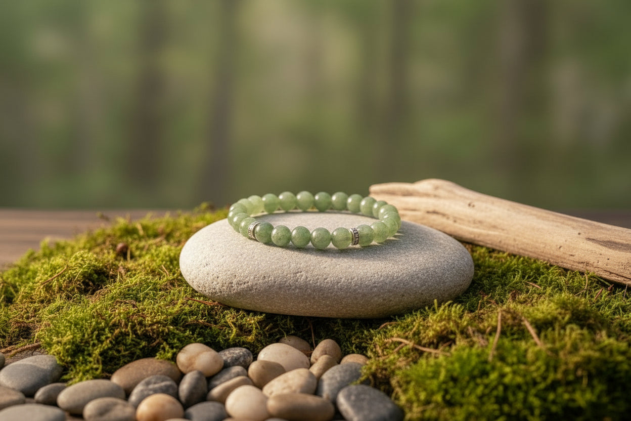 Stack of green beaded bracelet on a stone with a natural background