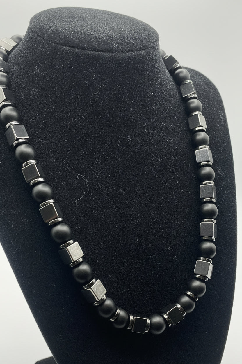 Matte Black Onyx and Hematite Flat Spacer Bead Necklace on black bust display, full length