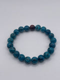 Blue beaded bracelet on a white background