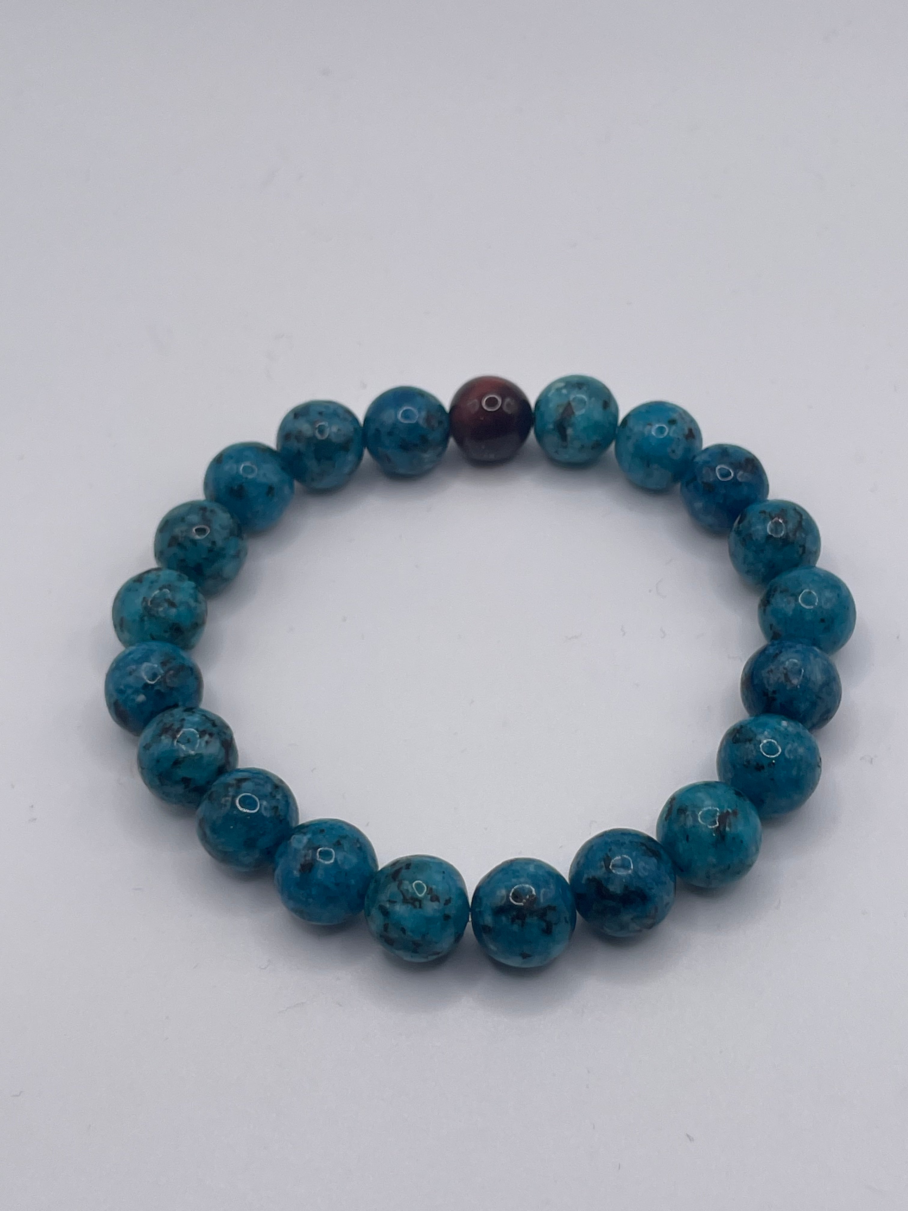 Blue beaded bracelet on a white background