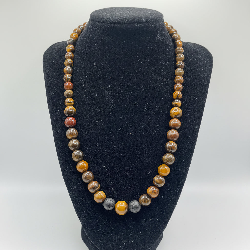 Beaded necklace on a black velvet stand with a white background