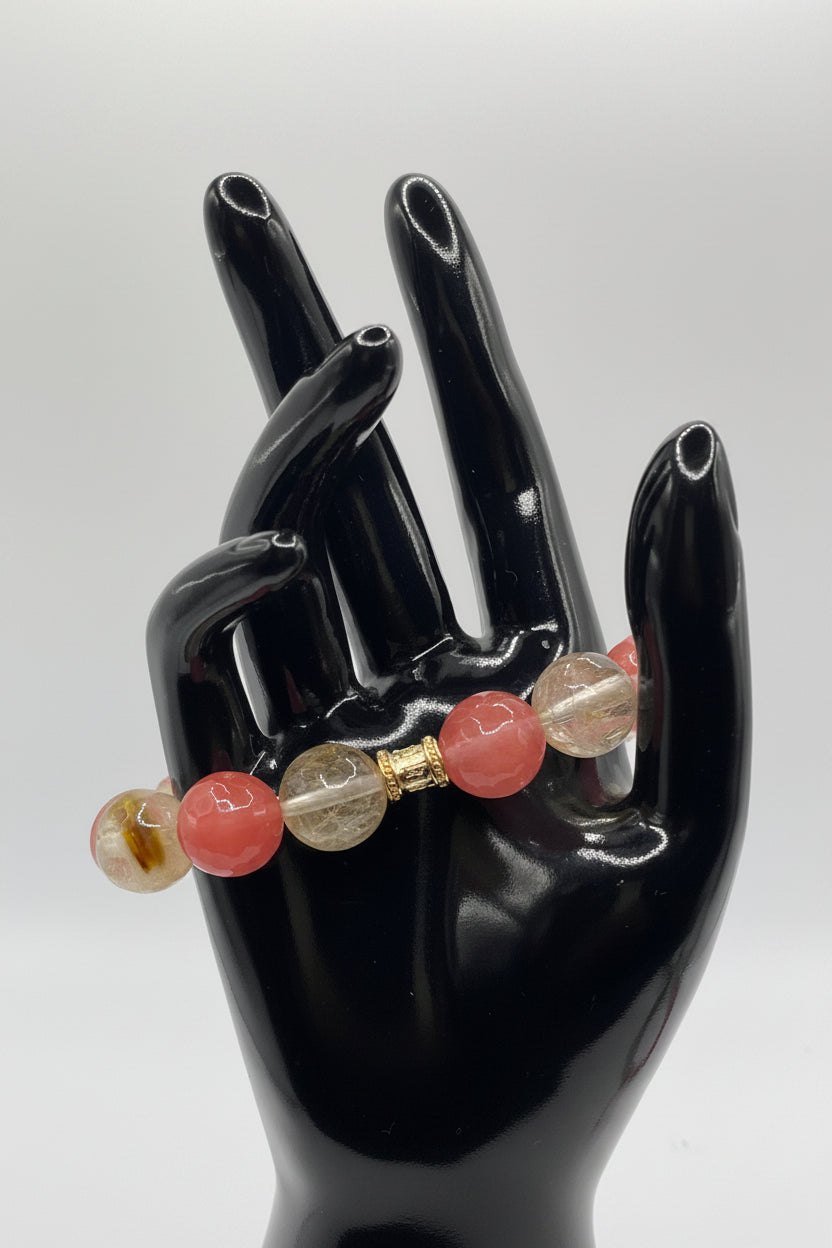Bracelet with multicolored beads on a black hand-shaped display