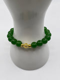 Raw jade 10mm bracelet with 18kt gold focal bead on wrist display
