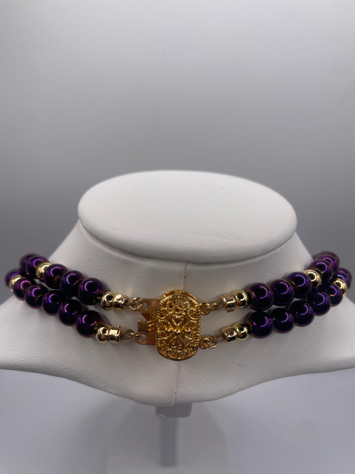 Purple Hematite 6mm double chain necklace showing gold tone clasp closure detail
