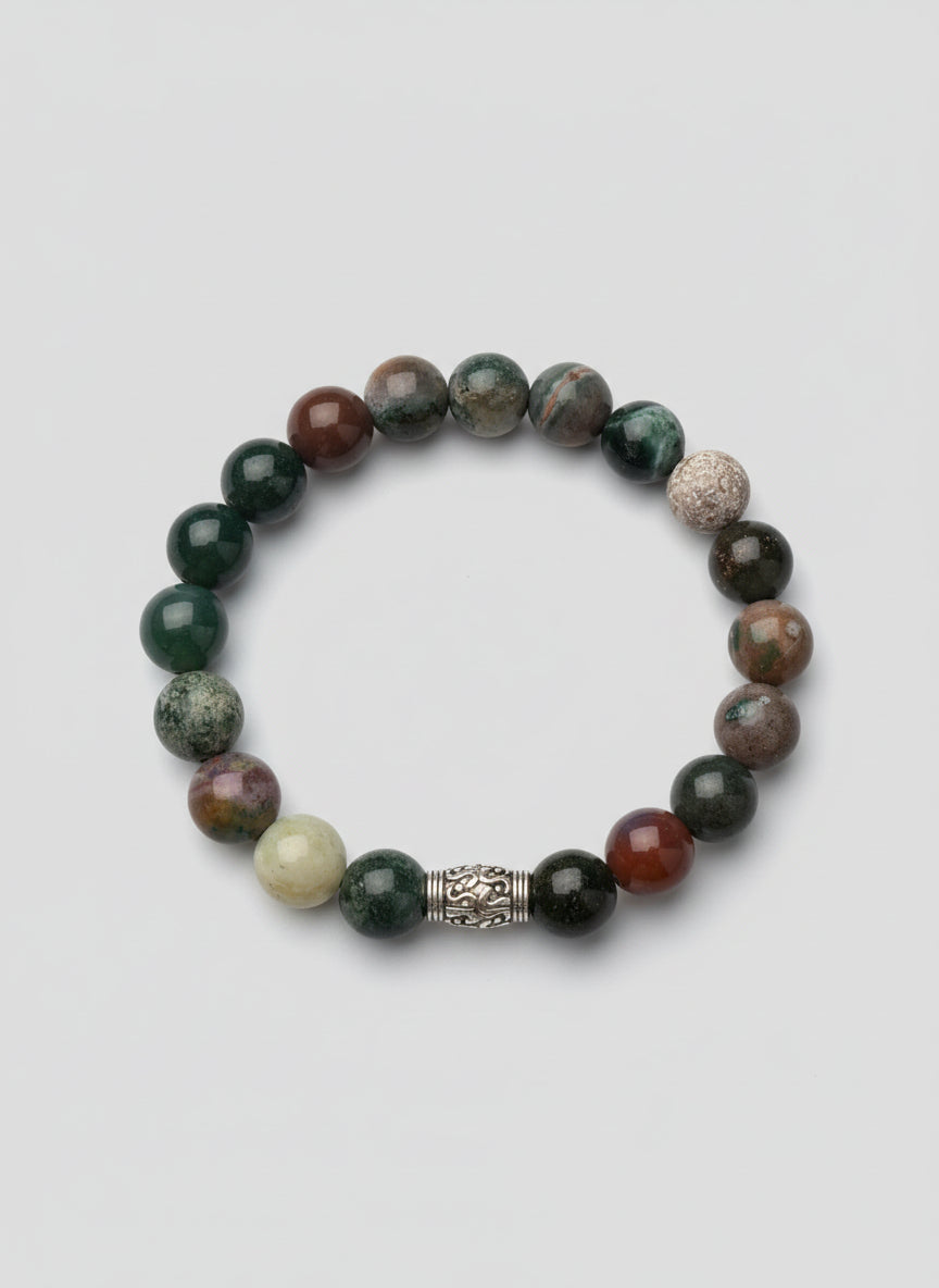 Multicolored beaded bracelet on a wooden surface Indian Agate bracelet with a spacer