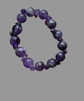 Purple beaded bracelet on a wooden surface