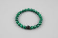 Malachite & Black Onyx Bracelet on wooden surface