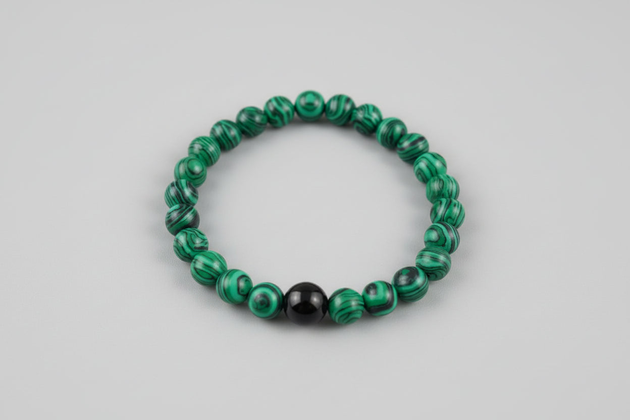Malachite & Black Onyx Bracelet on wooden surface