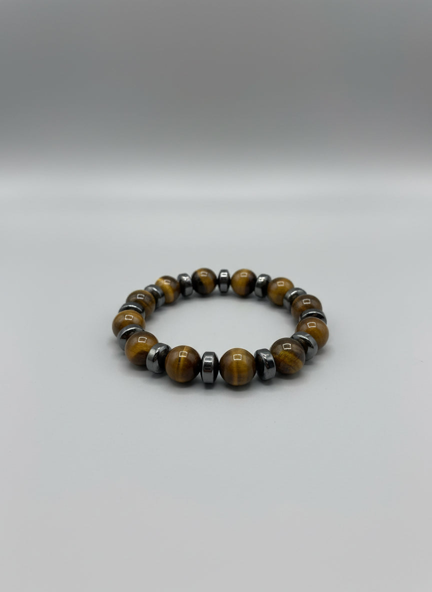 Yellow and brown beaded bracelet on a wooden surface
