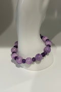 Purple Persian Gulf Chalcedony and faceted amethyst rondelle stretch bracelet on display stand
