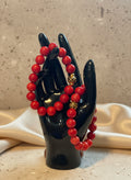 Vibrant red coral beads bring passion and energy to this handcrafted piece. A fiery accent for those who love to stand out.