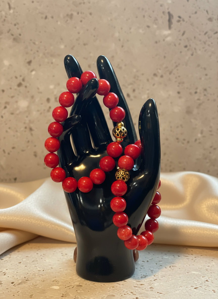 Vibrant red coral beads bring passion and energy to this handcrafted piece. A fiery accent for those who love to stand out.