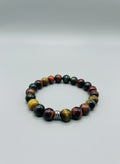 Multicolored beaded bracelet on a wooden surface