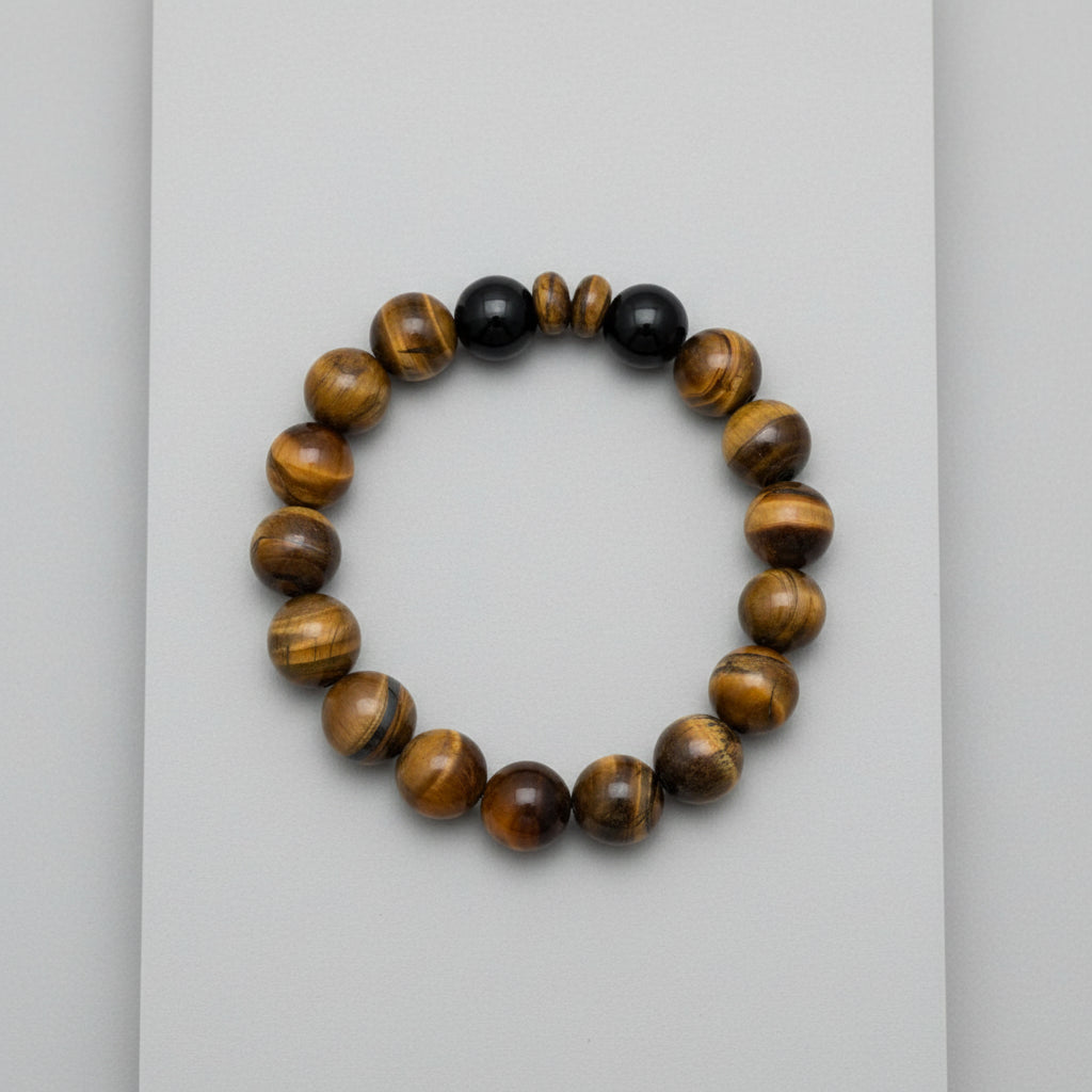 Beaded bracelet with tiger eye stones Tiger and Black Onyx Beads and two rondelle on a wooden surface