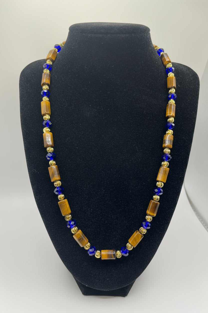Beaded necklace on a black bust with a white background