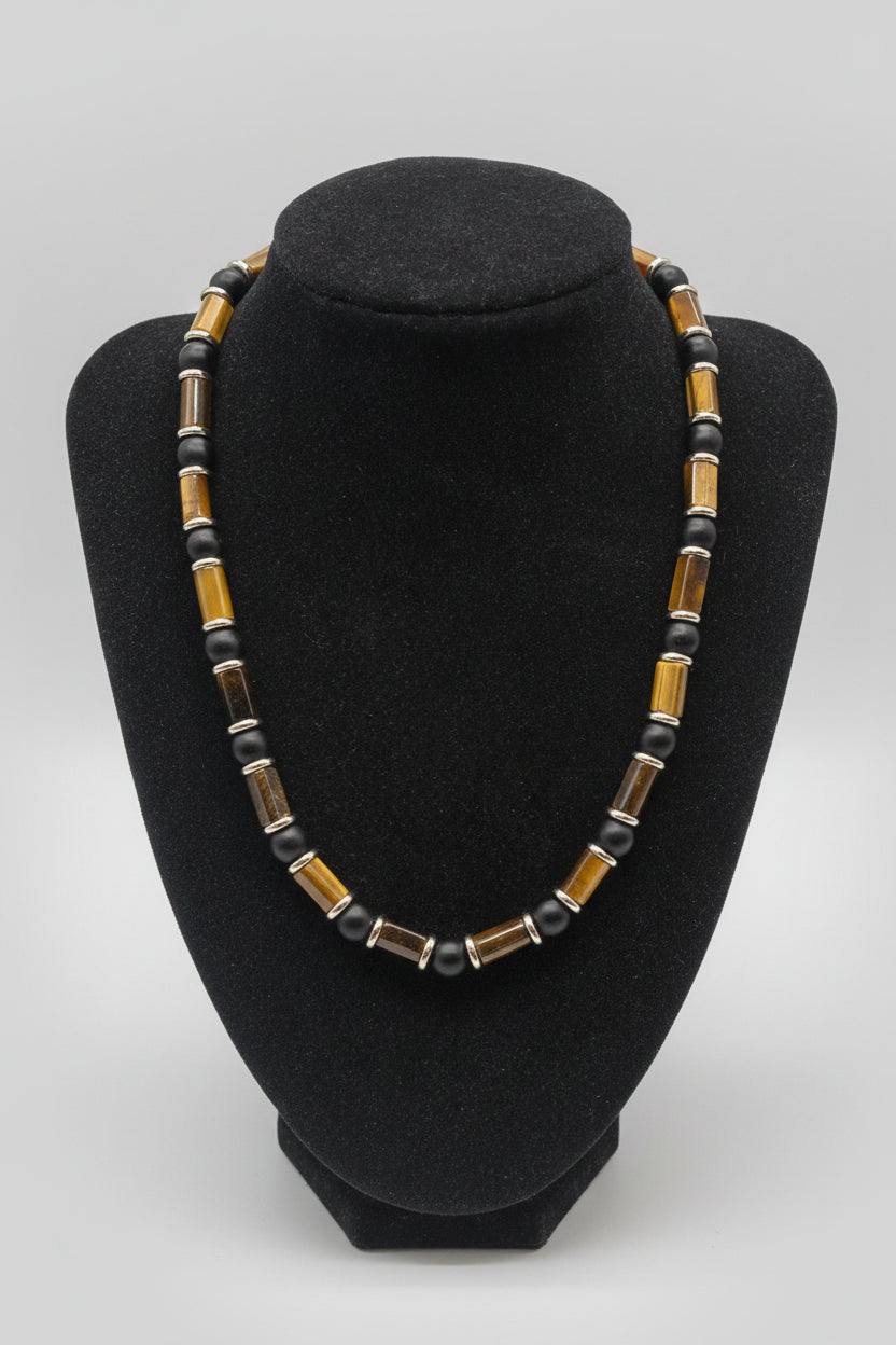 Tiger Eye Cylinder Choker Necklace with 18K Gold Hematite Spacers on black velvet bust display