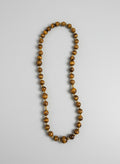 Beaded necklace on a light gray background