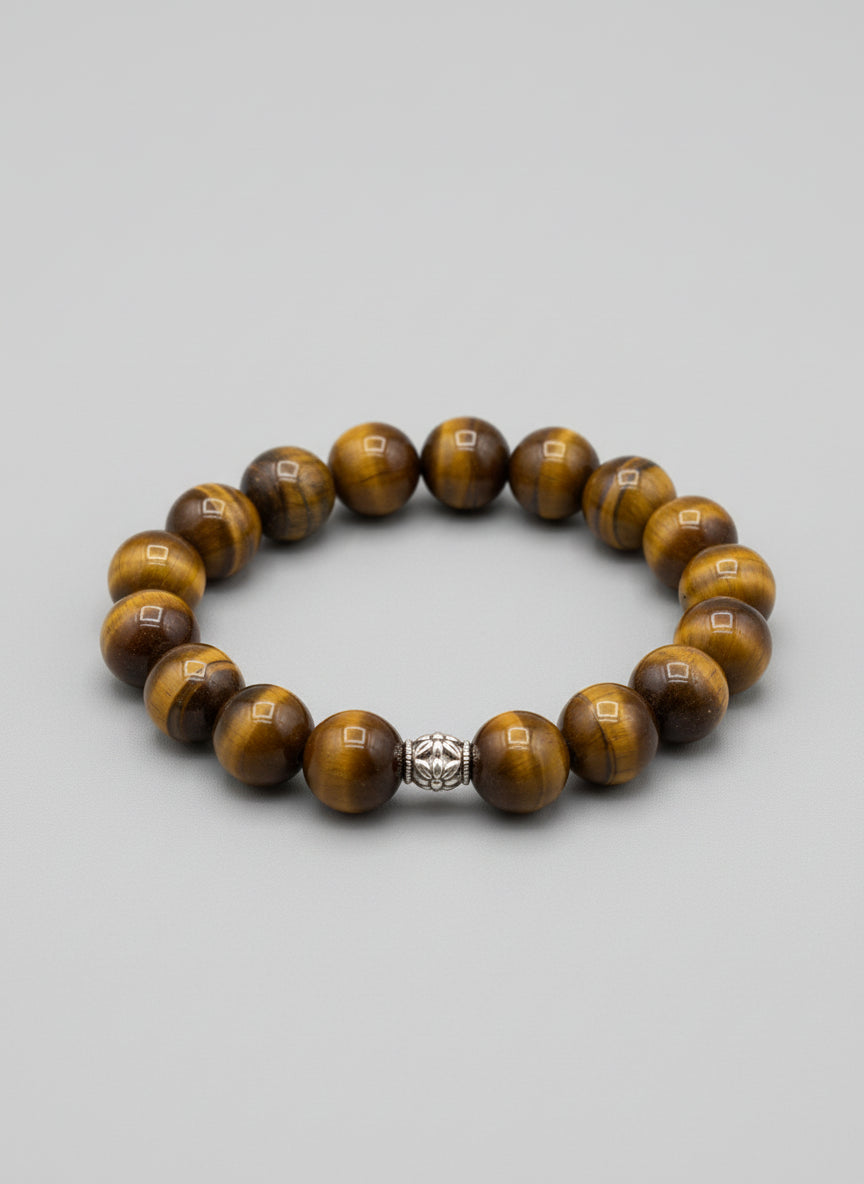 Bracelet with tiger eye stones on a wooden surface
