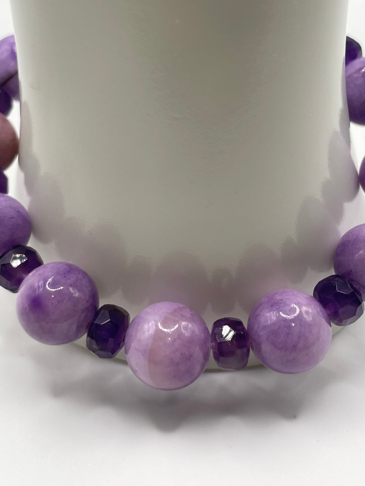 Close-up of purple Persian Gulf Chalcedony and faceted amethyst rondelle bracelet beads