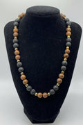 Necklace with multicolored beads on a black stand