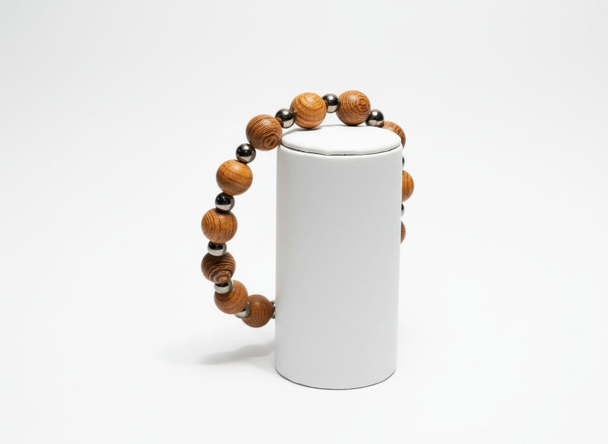Wooden beaded bracelet on a textured gray background