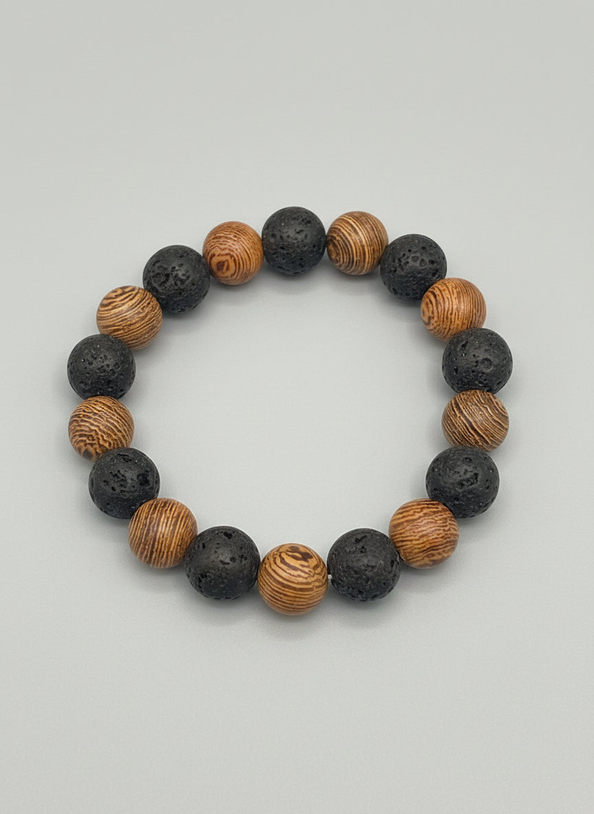Bracelet with alternating brown and black beads on a textured surface